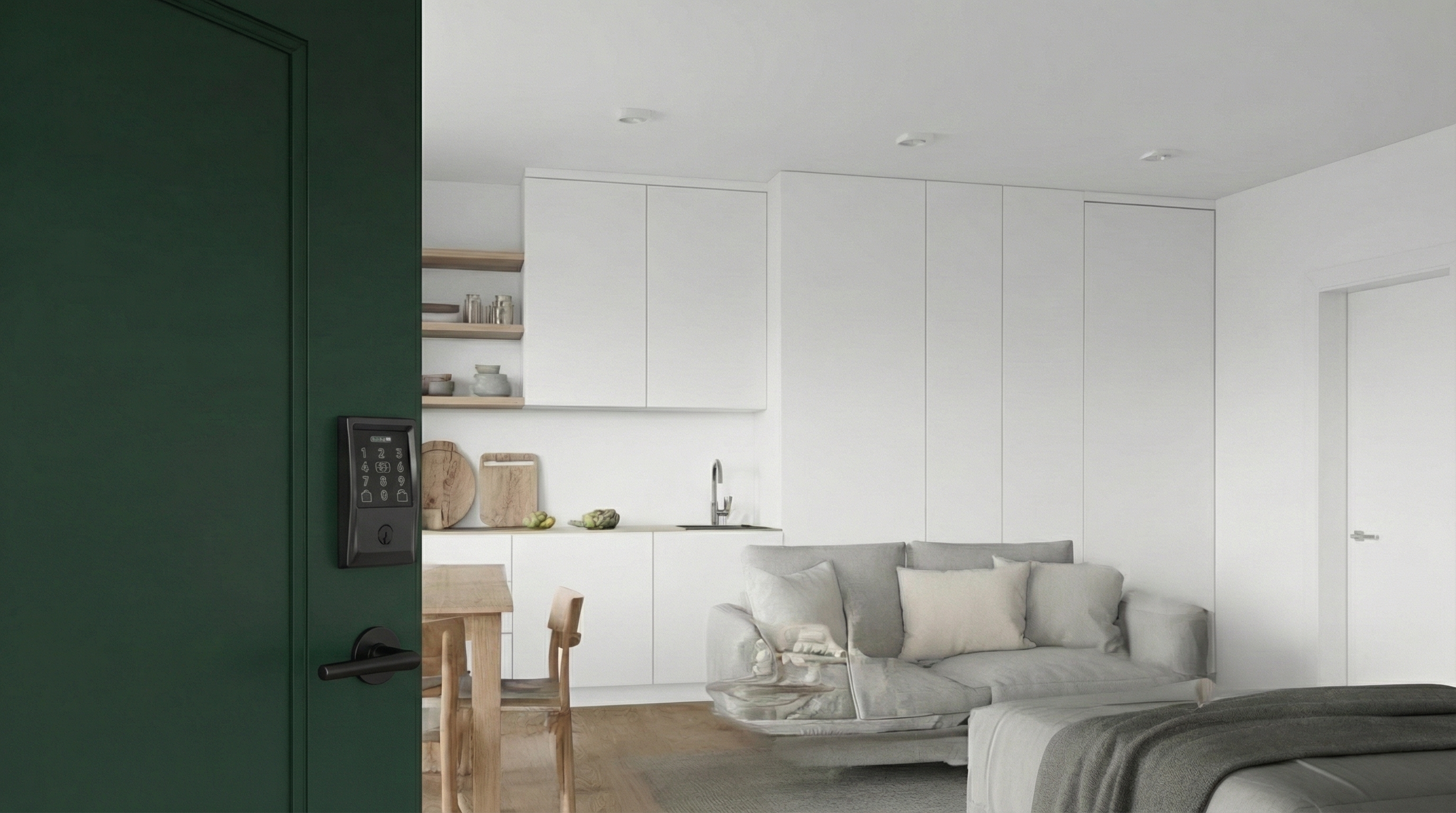 Dark green door with a smart keypad lock, opening into a modern white kitchen and living area.